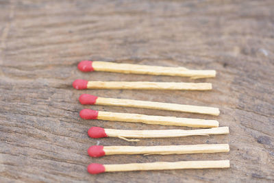 Close-up of matchsticks on wooden table
