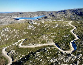 Aerial view of landscape against clear blue sky