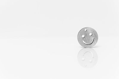 Close-up of metal object over white background