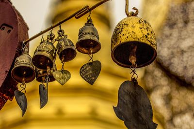 Low angle view of lighting equipment hanging on ceiling