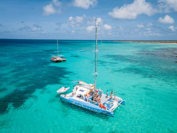 Sailboat on sea against sky