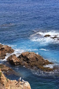 Scenic view of sea against blue sky