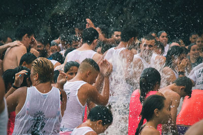 Group of people enjoying in water