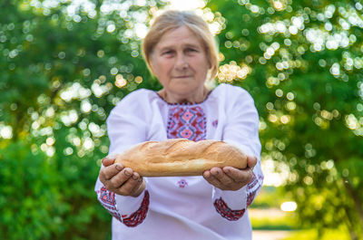 Portrait of woman holding food