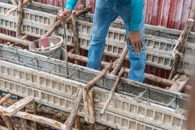 Midsection of man working at construction site