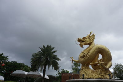 Low angle view of statue against sky