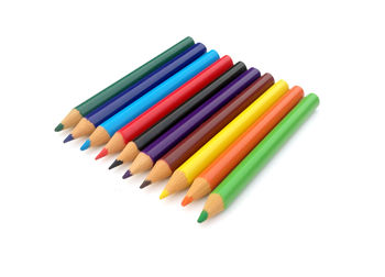 High angle view of colored pencils against white background