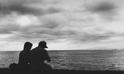 Scenic view of sea against cloudy sky