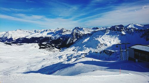 Scenic view of snow covered mountains