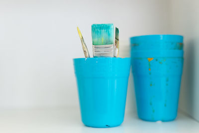 Close-up of blue glass on table