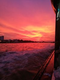 Scenic view of sea against orange sky