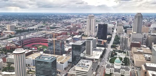 High angle view of modern buildings in city against sky