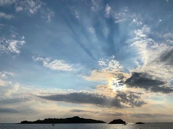 Low angle view of sea against sky during sunset