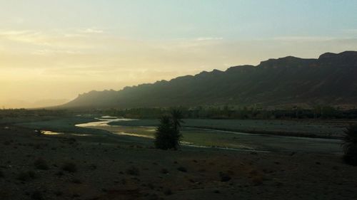 View of beach against cloudy sky