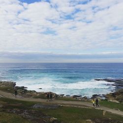 Scenic view of sea against cloudy sky