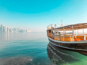 View of ship in sea against buildings