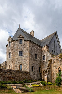 Low angle view of old building against sky