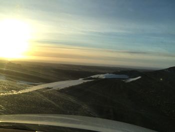 Aerial view of landscape against sky during winter