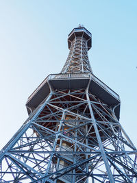 Low angle view of communications tower against clear sky