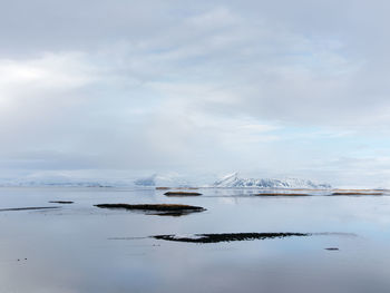 Scenic view of sea against sky during winter