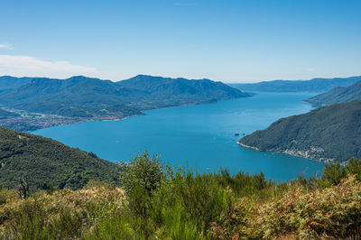 Aerial view of the lake maggiore with blue sky from a mountain