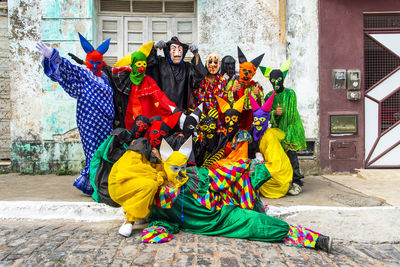 Group of people wearing carnival mask