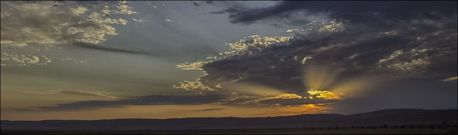 Scenic view of landscape against sky during sunset