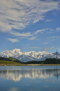 Scenic view of lake by the mont blanc in the french alpes mountains against sky