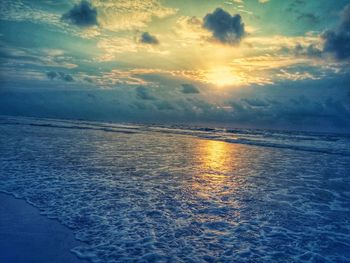 Scenic view of sea against sky at sunset