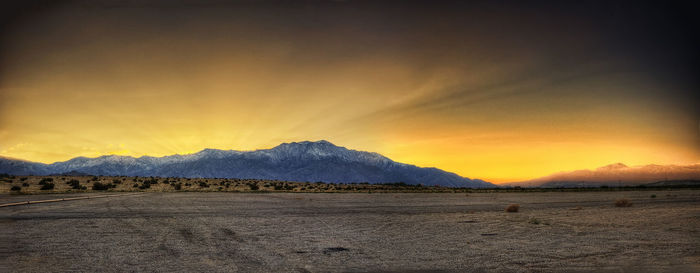 Scenic view of landscape against sky during sunset