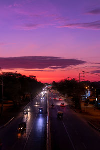 High angle view of traffic on road at sunset