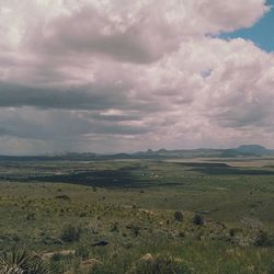 Scenic view of landscape against cloudy sky