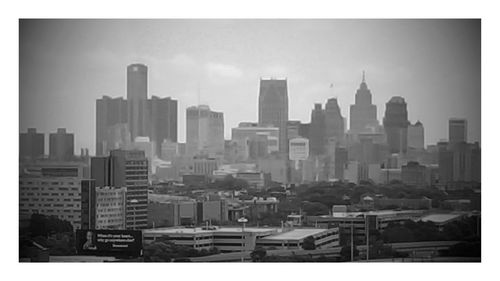 Modern buildings in city against sky