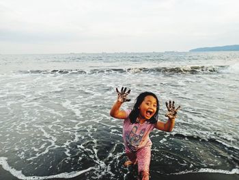 Young girls play at the beach