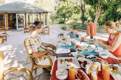 Family sitting on table