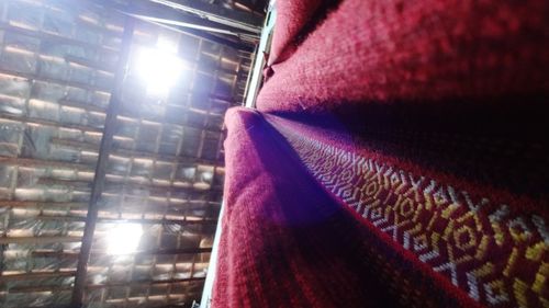 Low angle view of illuminated lights on ceiling