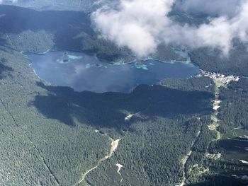 High angle view of land and mountains against sky