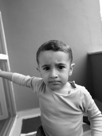 Portrait of boy playing at home