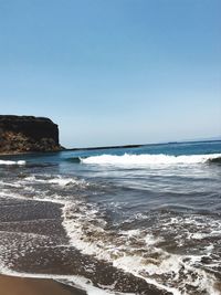 Scenic view of sea against clear sky