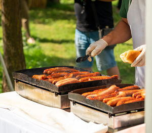 Midsection of man preparing food