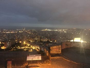 High angle view of illuminated city buildings at night