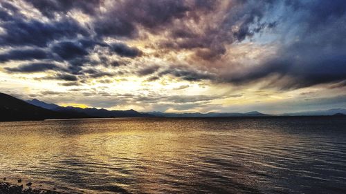 Scenic view of lake against sky during sunset