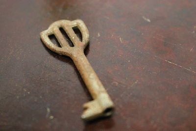 Close-up of rusty metal on table