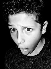 Close-up of shocked boy with mouth open