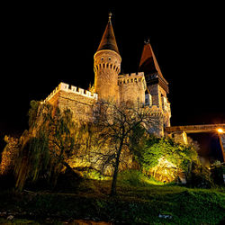 Low angle view of illuminated building at night