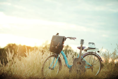 Bicycle on field against sky