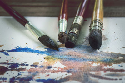 High angle view of paintbrushes on table