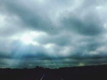 Scenic view of landscape against cloudy sky