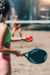Female team playing beach tennis