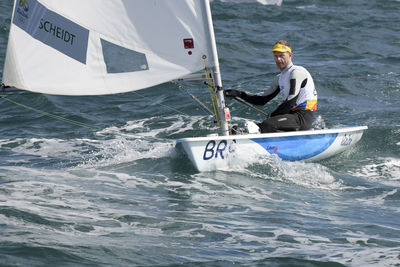 Man in boat on sea